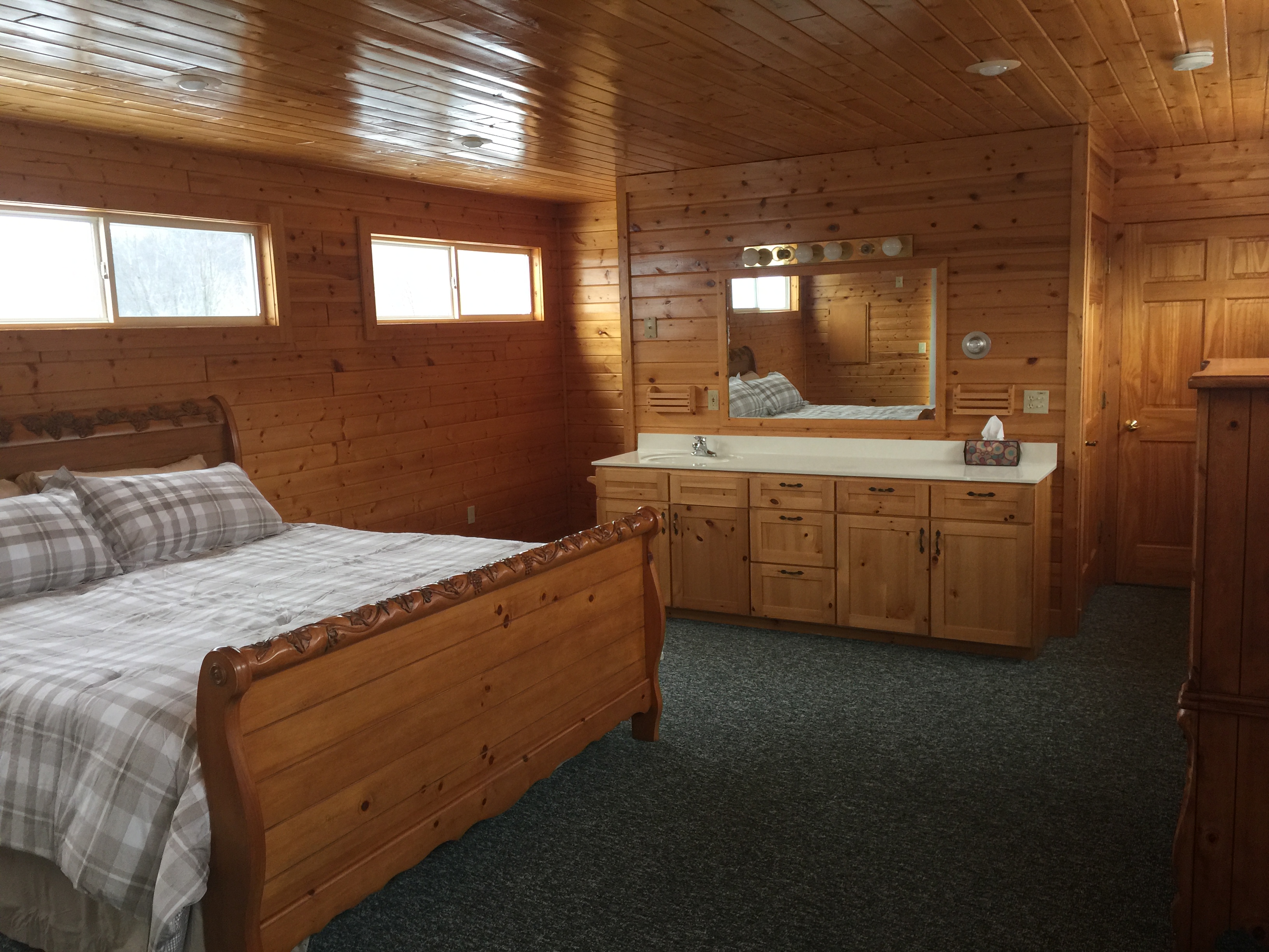 2nd Third floor master bedroom with private bathroom, including shower at Torch Lake Lodge.