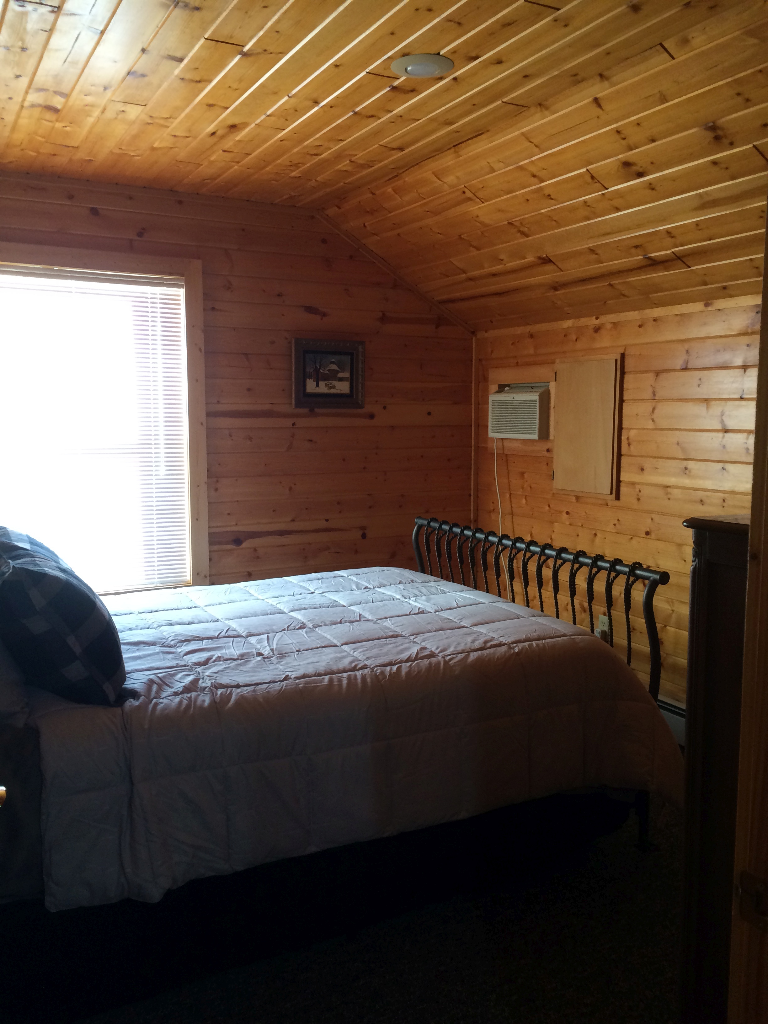 2nd of three second floor bedrooms at Torch Lake Lodge. View is of front of lodge.
