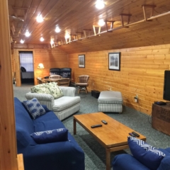 Seating area with cable TV at Torch Lake Lodge. All areas have high speed internet.