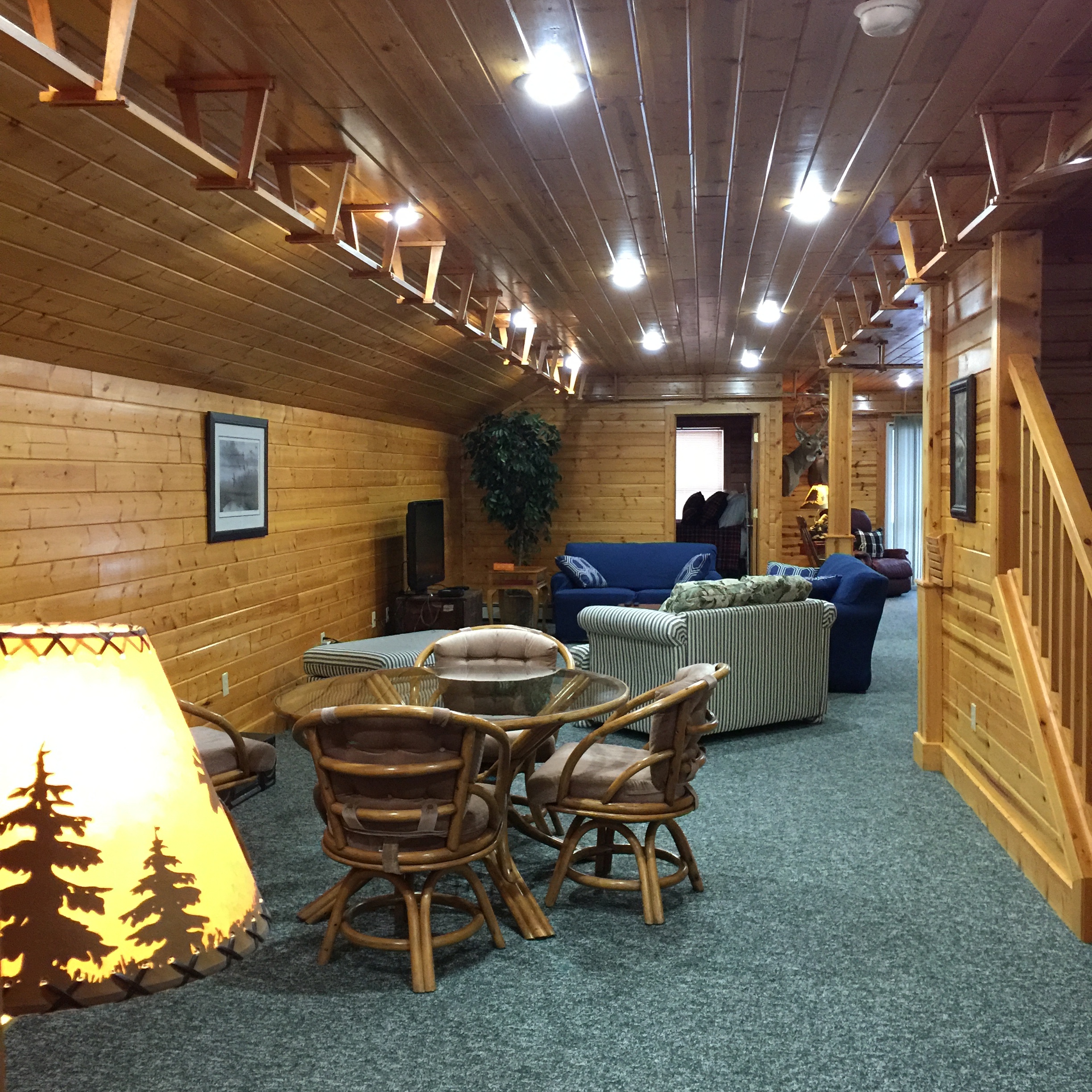 Seating area with cable TV at Torch Lake Lodge. All areas have high speed internet. Yes, there is an model train track around the entire 2nd floor. Train not included :).