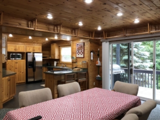 Dining area, kitchen, and deck with grill